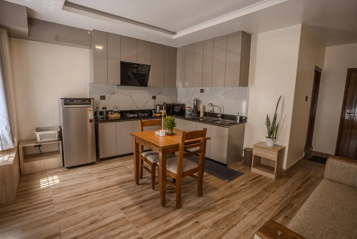 Classic Apartment kitchen with taupe cabinets